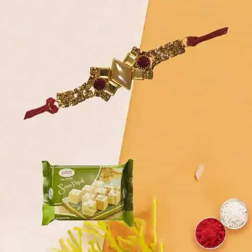 Mesmerizing Gift Set of Haldiram Soan Papri with Rakhi Roli Tika and Chawal for the Occasion of Raksha Bandhan