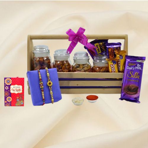 Pretty Stone Rakhi Pair with Cadbury Assortments n Flavor Cashews